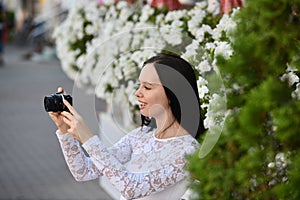 Young woman photographer with digital camera