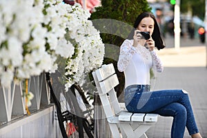 Young woman photographer with digital camera