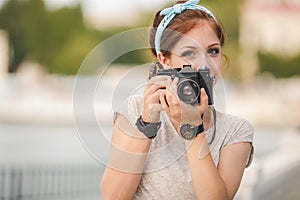 Young woman photographer portrait. Soft colors.