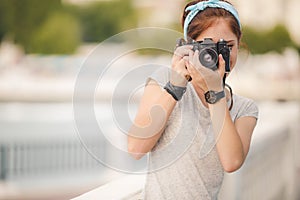 Young woman photographer portrait. Soft colors.