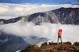 Young woman photographer taking photo for beautiful landscape on