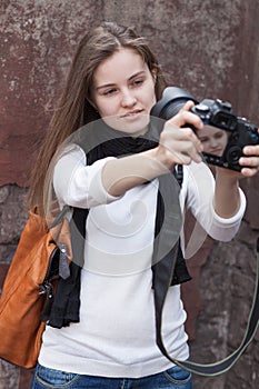 Young woman photographes itself photo