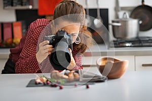 Young woman photographing food