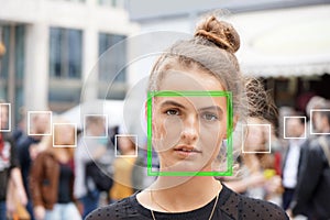 Young woman picked out by face detection or facial recognition software