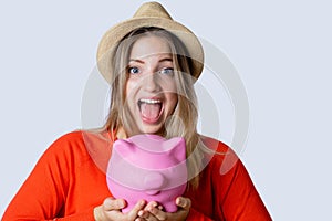 Young woman with piggy bank