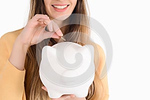 Young woman with piggy bank