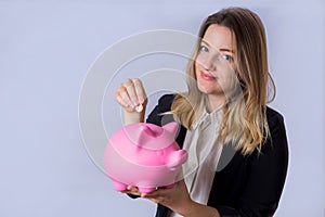 Young woman with piggy bank