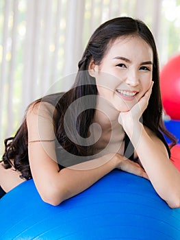 Young woman pilates exercise with fitness ball.