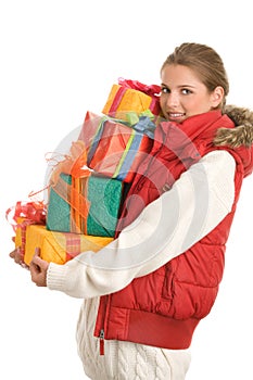 Young woman with pile of gifts