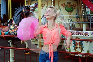 Young woman with pink cotton candy