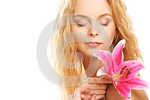 Young woman with pink lily
