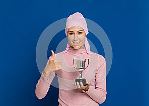 Young woman with pink scarf on the head