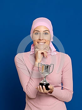 Young woman with pink scarf on the head