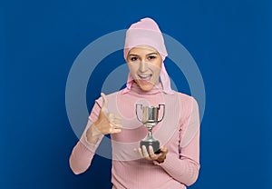 Young woman with pink scarf on the head