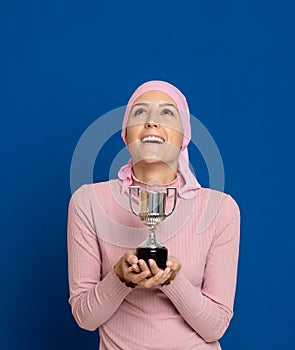 Young woman with pink scarf on the head