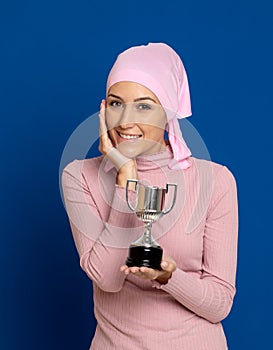 Young woman with pink scarf on the head