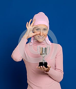 Young woman with pink scarf on the head