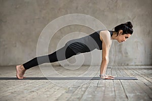 Young woman in Plank pose