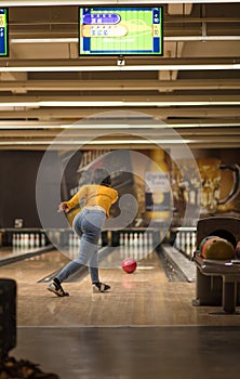 Young woman play bowling