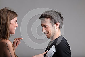 Playful woman taps, boyfriend tolerates photo