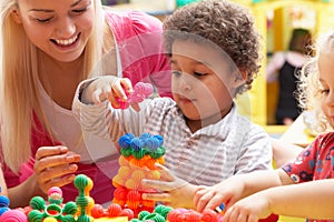 Young woman playing with boy