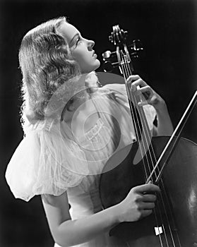 Young woman playing a cello