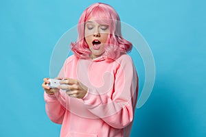 young woman playing games joystick fun isolated background