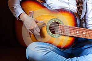 Young woman playing guitar