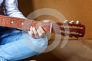 Young woman playing guitar