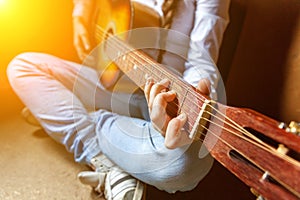 Young woman playing guitar