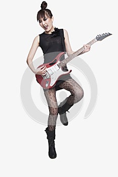 Young Woman Playing Guitar