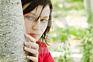 Young woman playing hide and seek