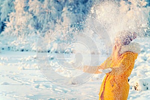 Young Woman playing with snow Outdoor Winter Lifestyle