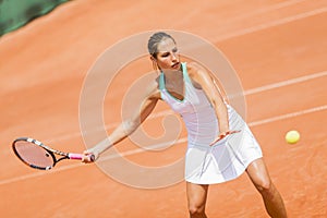 Young woman playing tennis