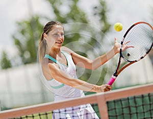 Young woman playing tennis