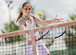 Young woman playing tennis