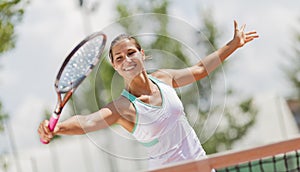 Young woman playing tennis