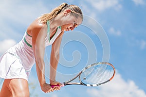 Young woman playing tennis