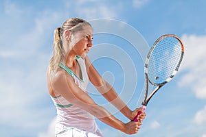 Young woman playing tennis