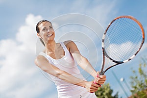 Young woman playing tennis