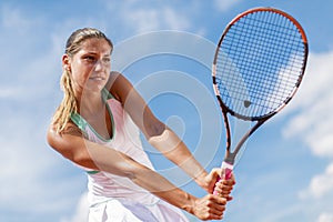 Young woman playing tennis