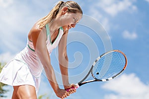 Young woman playing tennis