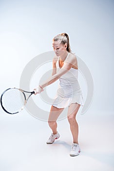 Young woman playing tennis