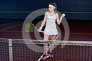 Young Woman Playing Tennis in Court