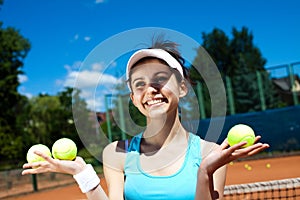 Young woman playing tennis, summertime saturated theme