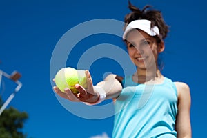 Young woman playing tennis, summertime saturated theme