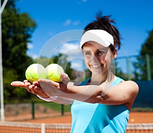 Young woman playing tennis, summertime saturated theme