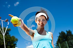 Young woman playing tennis, summertime saturated theme