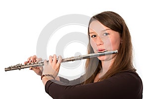 Young woman is playing the transverse flute