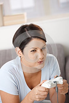 Young woman playing video game